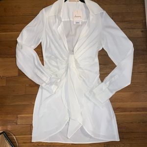 white fitted long sleeve dress with deep neckline